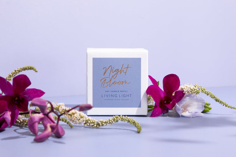 Living Light Night Bloom soy candle refill box, styled with vibrant orchids and delicate florals. Handcrafted in New Zealand.