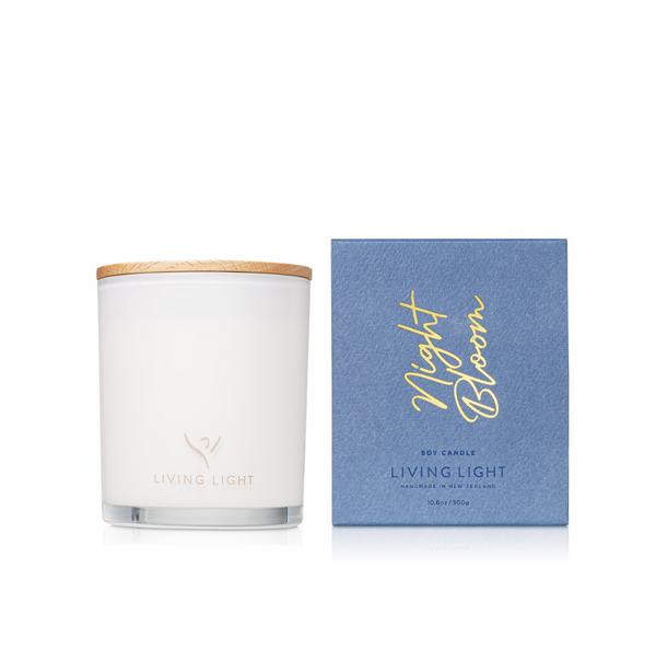 Living Light Night Bloom soy candle in white glass jar with wooden lid, shown beside its elegant blue gift box. Handcrafted in New Zealand.